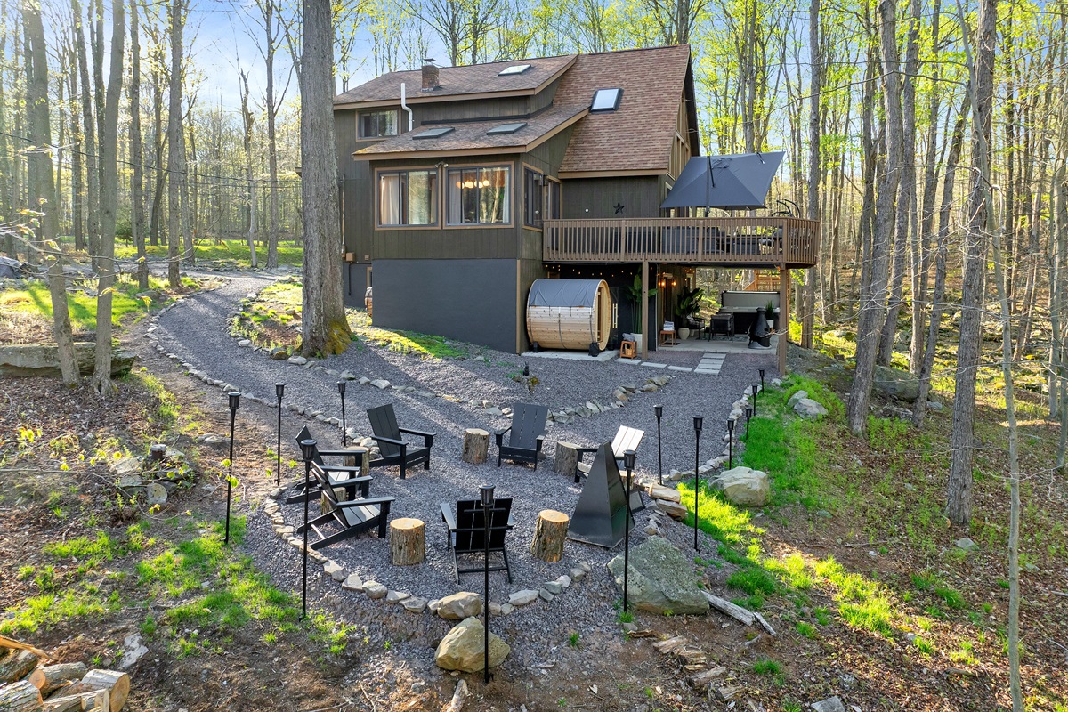 “Modern chalet lines and forest backdrop — private and peaceful.”