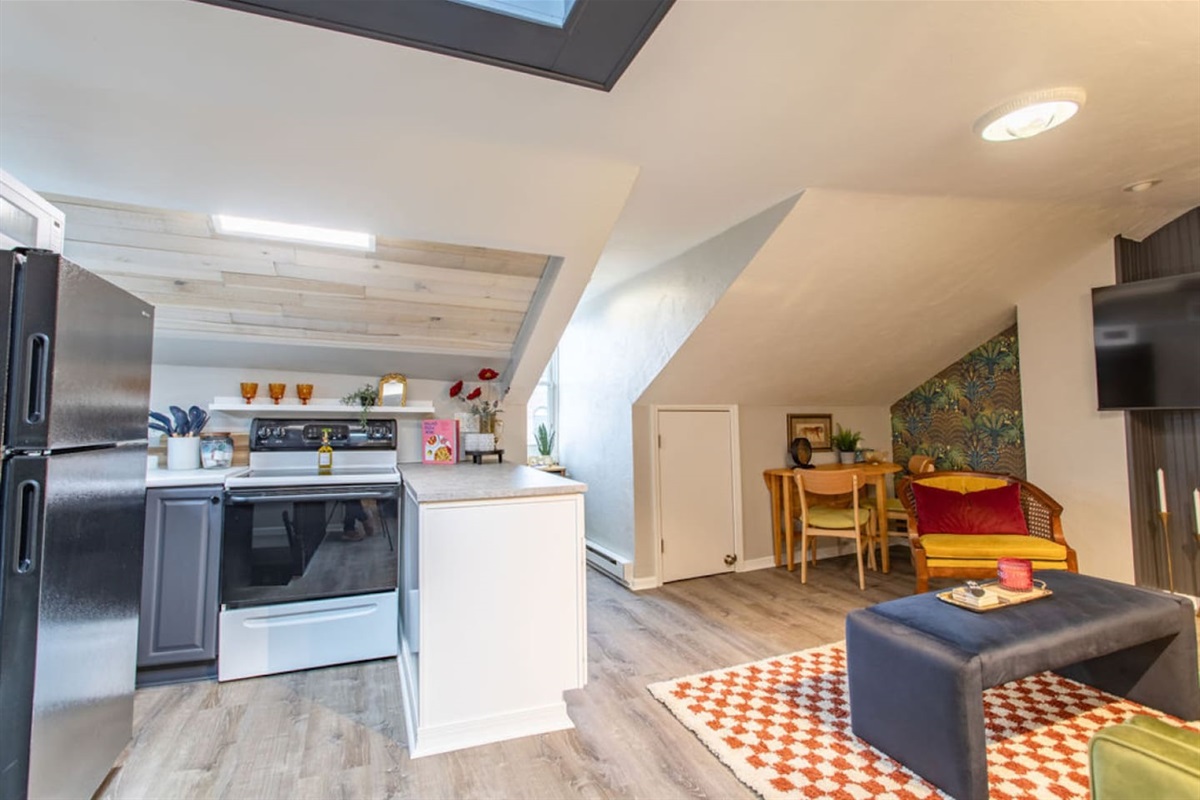 Step into this vibrant 1-bedroom apartment and be captivated by the stylish, open-concept design. The compact kitchen, though small, is thoughtfully designed with bold decor and sleek finishes, seamlessly blending with the cozy living area. This chic