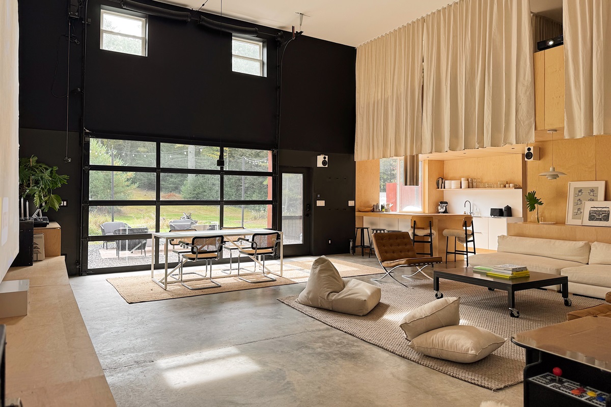 Living area with curtained second floor loft.