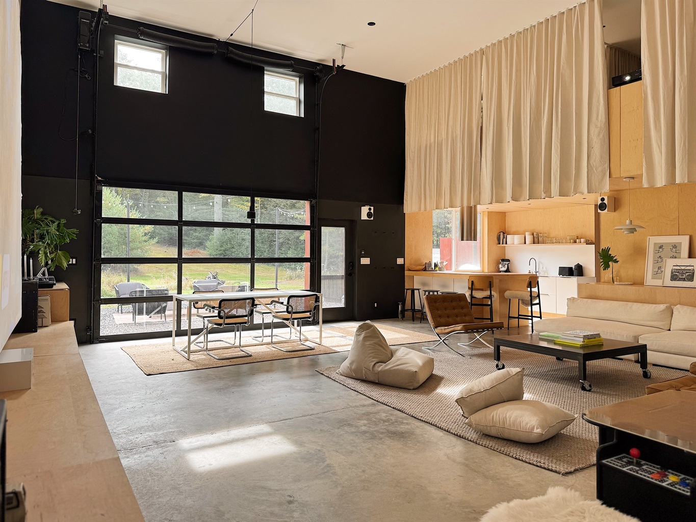 Living area with curtained second floor loft.