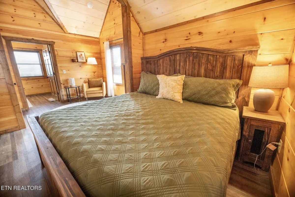 Rest and recharge in the luxurious King Master Suite at Marigold Cabin, a premier 3-bedroom vacation rental in Pigeon Forge, TN. Designed for comfort and relaxation, the master suite features a plush king bed and thoughtful d&eacute;cor &mdash; the perfect retreat 