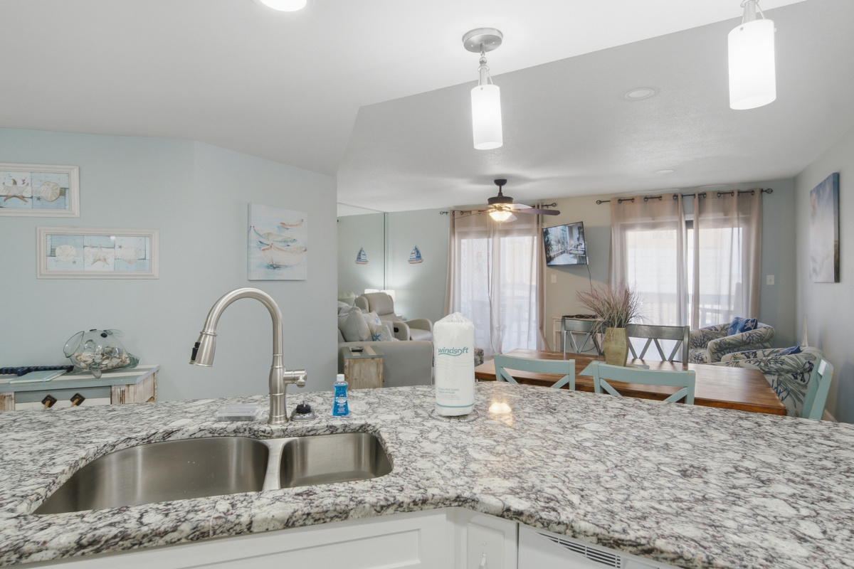 Deep kitchen sink with granite counters, steps from the breakfast nook