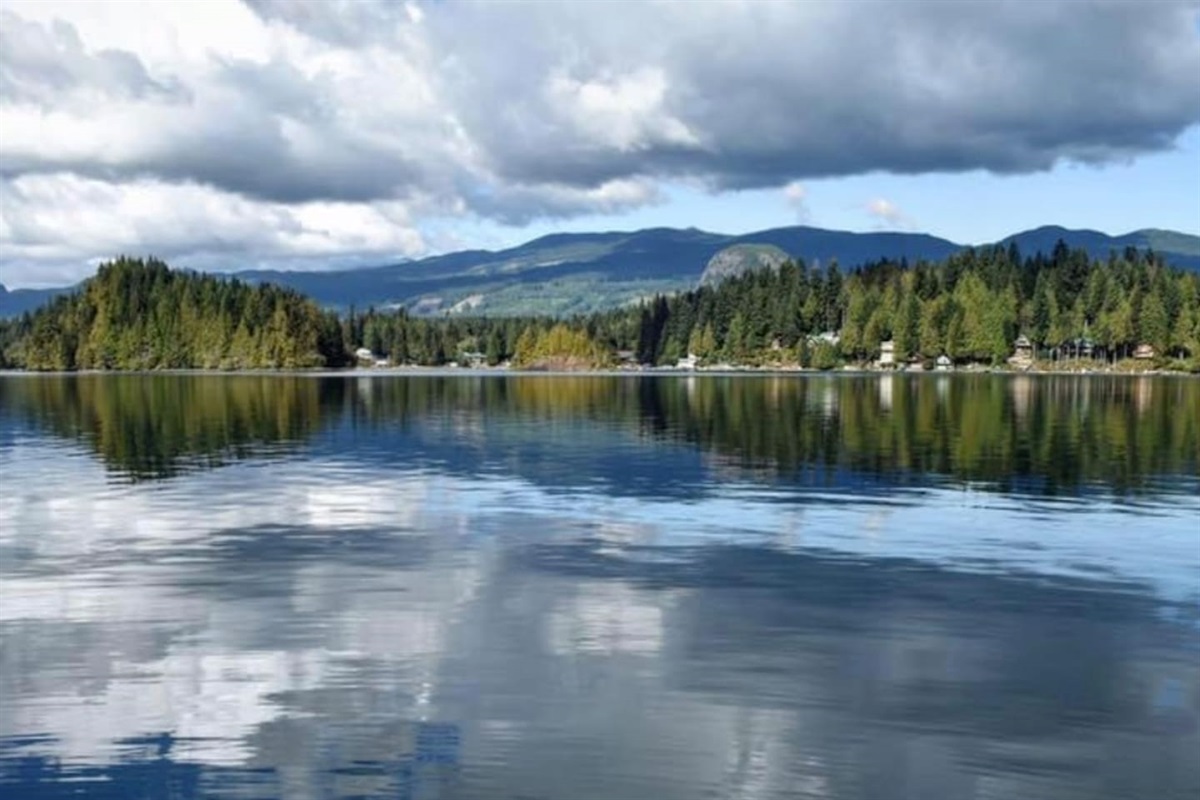 Calm, glassy lake inviting kayaking and peaceful paddling.