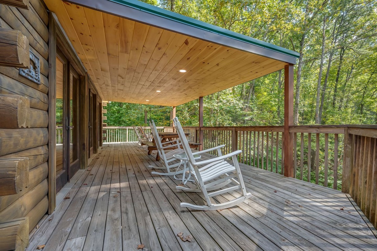 Back deck on main level, with wrap around deck, 2 sitting areas and large grill and smoker