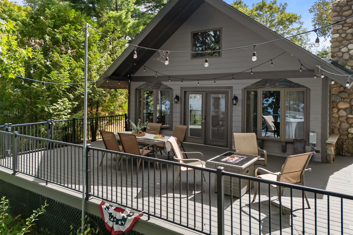 Patio doors from the living room open right onto the deck, blending indoor comfort with outdoor lake views.