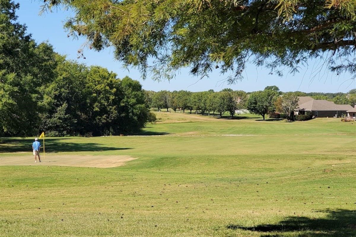 View from backyard, patio, and courtyard. Just steps to the golf course.