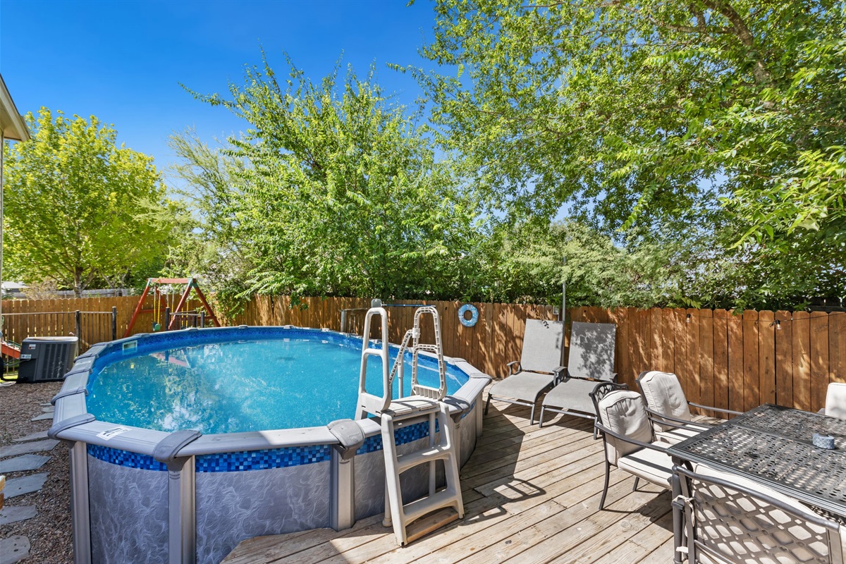 Above-ground pool with ladder access and patio space in a fully fenced backyard. Private and exclusive to your group. Perfect for cooling off after a day at Morgan's Wonderland or exploring San Antonio.