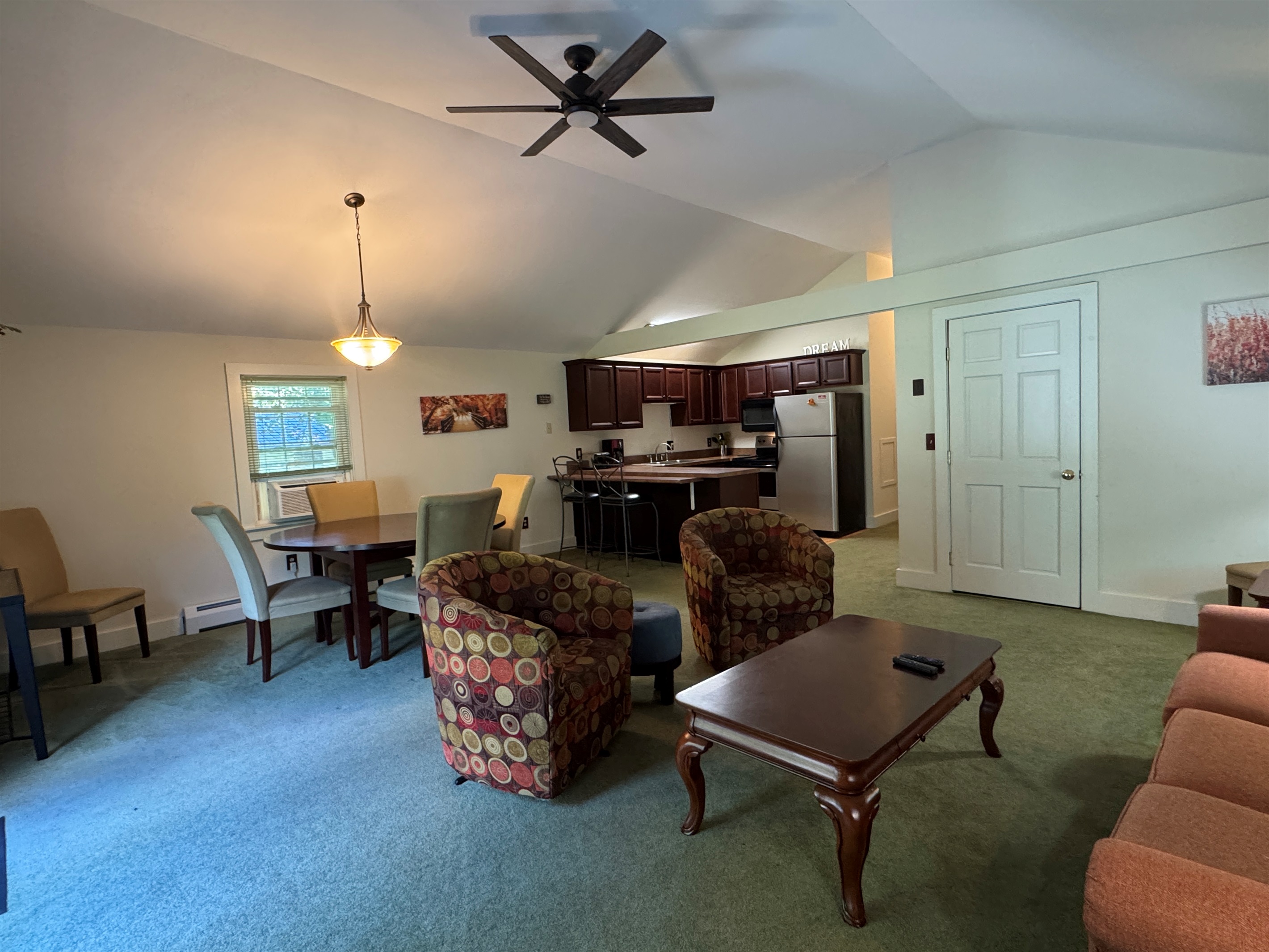Dandelion apartment overview of living room and dining area.
