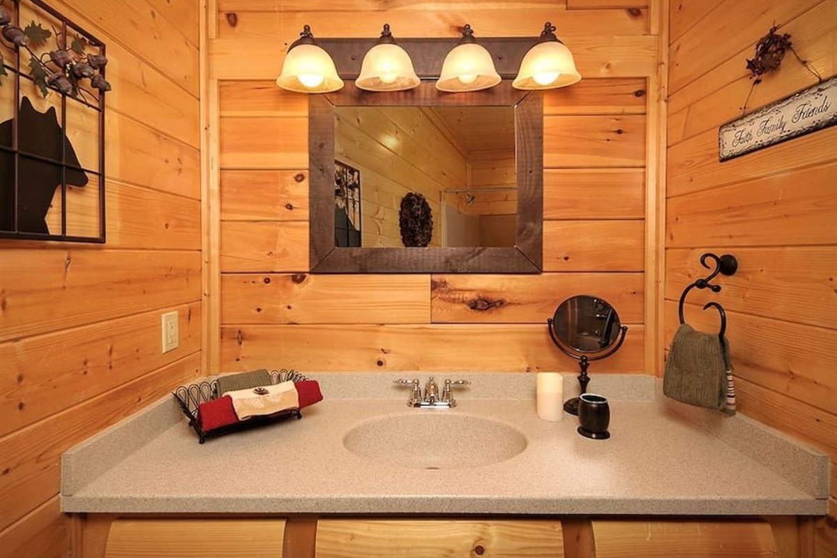 - Cabin-style vanity space with soft lighting and elegant rustic accents   - Simple, clean design blending comfort with authentic mountain warmth   - Ideal spot to refresh before exploring or relaxing in the hot tub