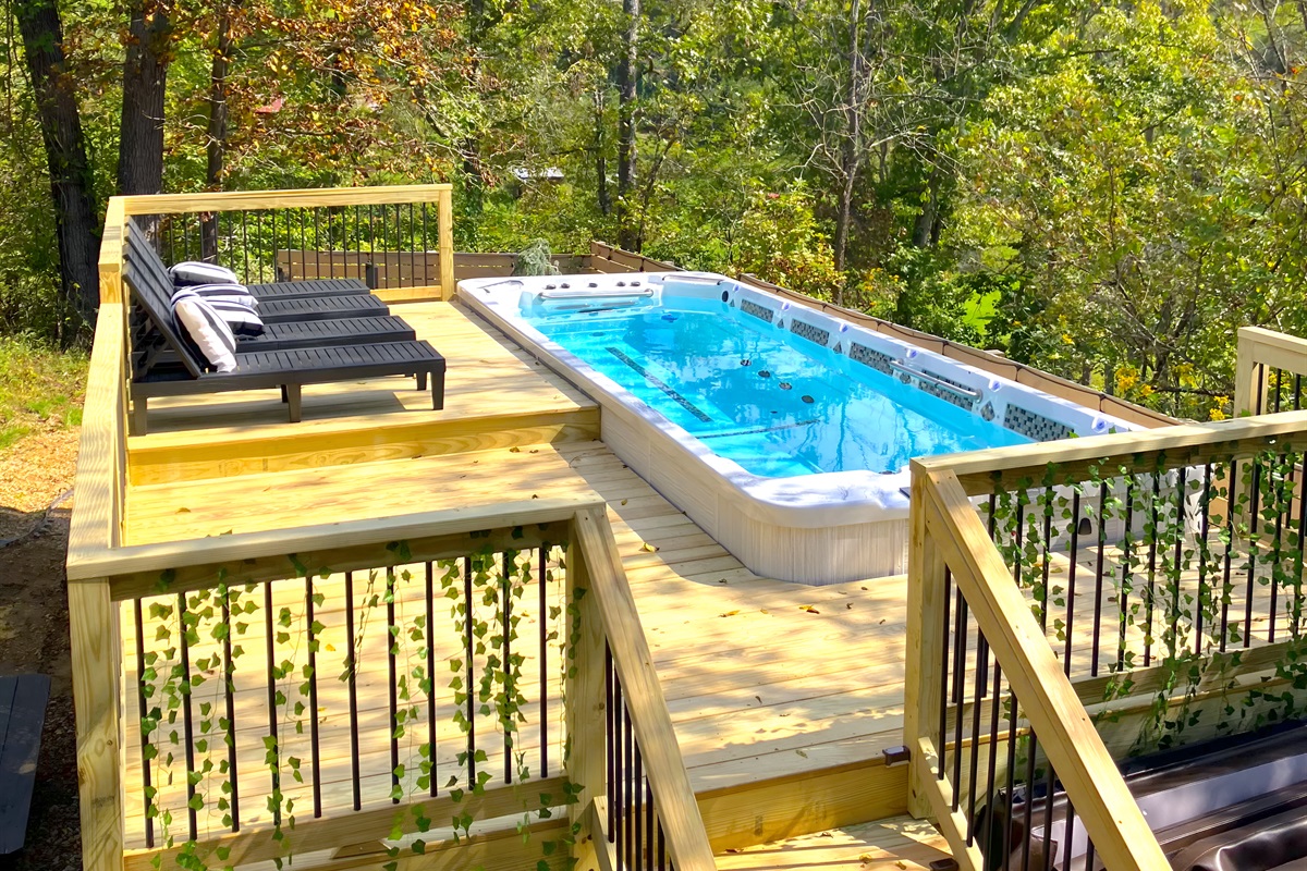 {Deck} Enjoy the 21 ft Heated Swim Spa Pool.