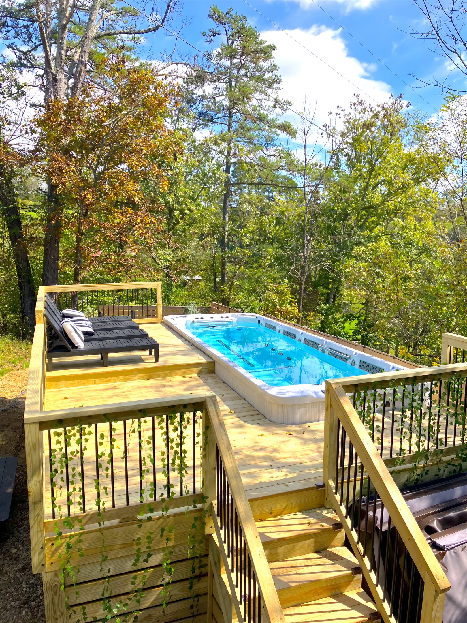 {Deck} Enjoy the 21 ft Heated Swim Spa Pool.