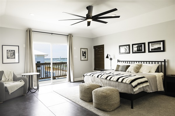 Primary Suite with king bed and private deck with Lagoon and Gulf views