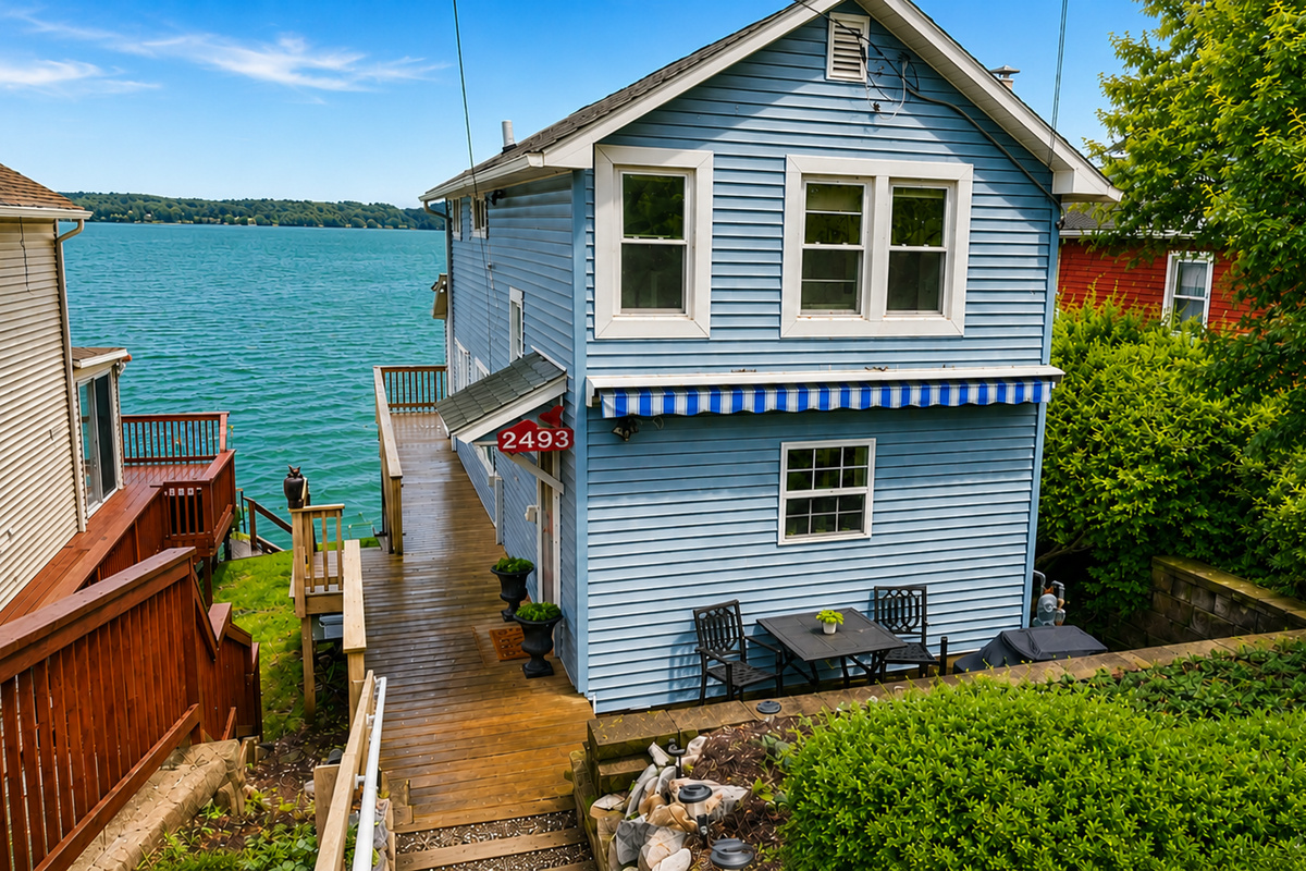 Blue cottage exterior near the shoreline
