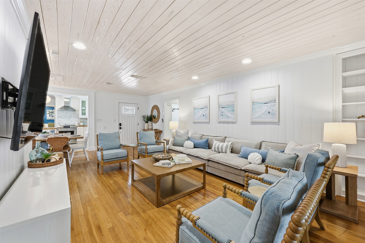 Open floor plan with ample plush seating for family movie nights