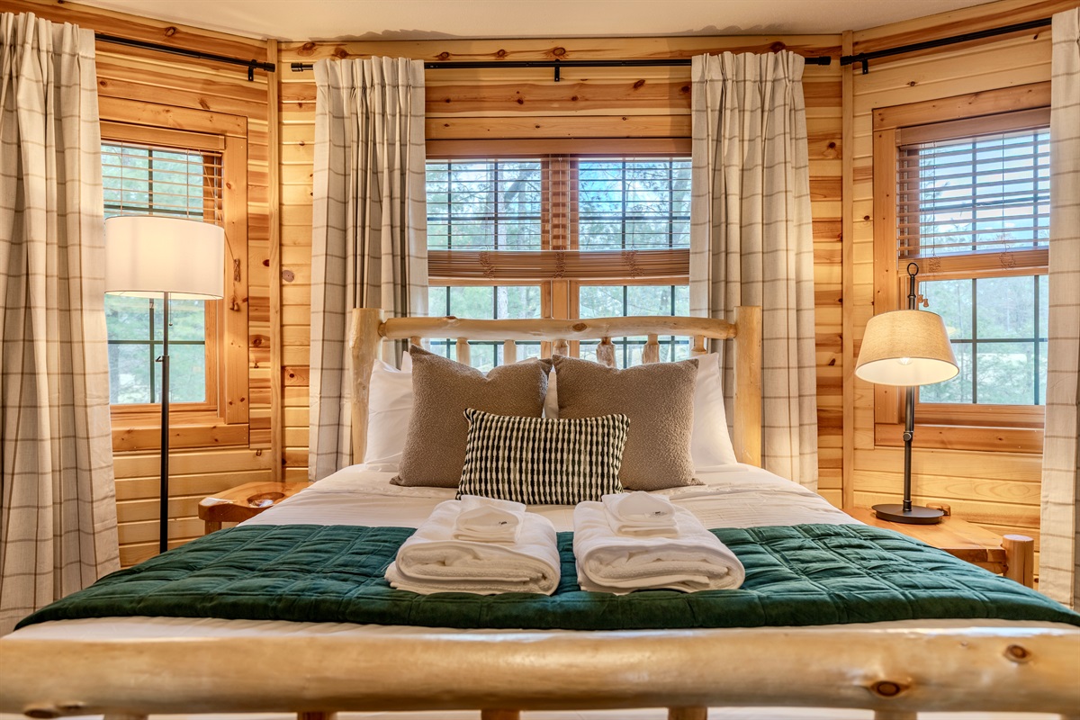 Upstairs bedroom with a queen & double bed.