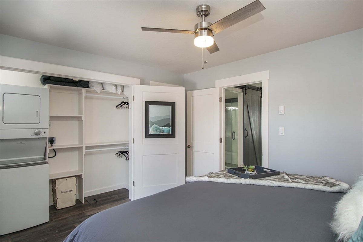 Bedroom with convenient in-unit laundry—perfect for extended stays.