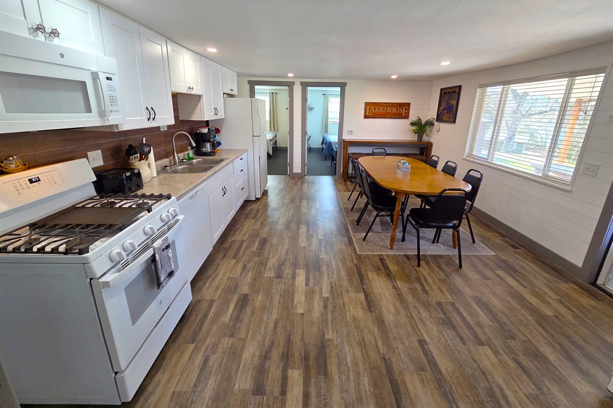 The large kitchen & dining area is perfect for dinners with the table that seats 8 & the bar at the end that can accommodate 4.