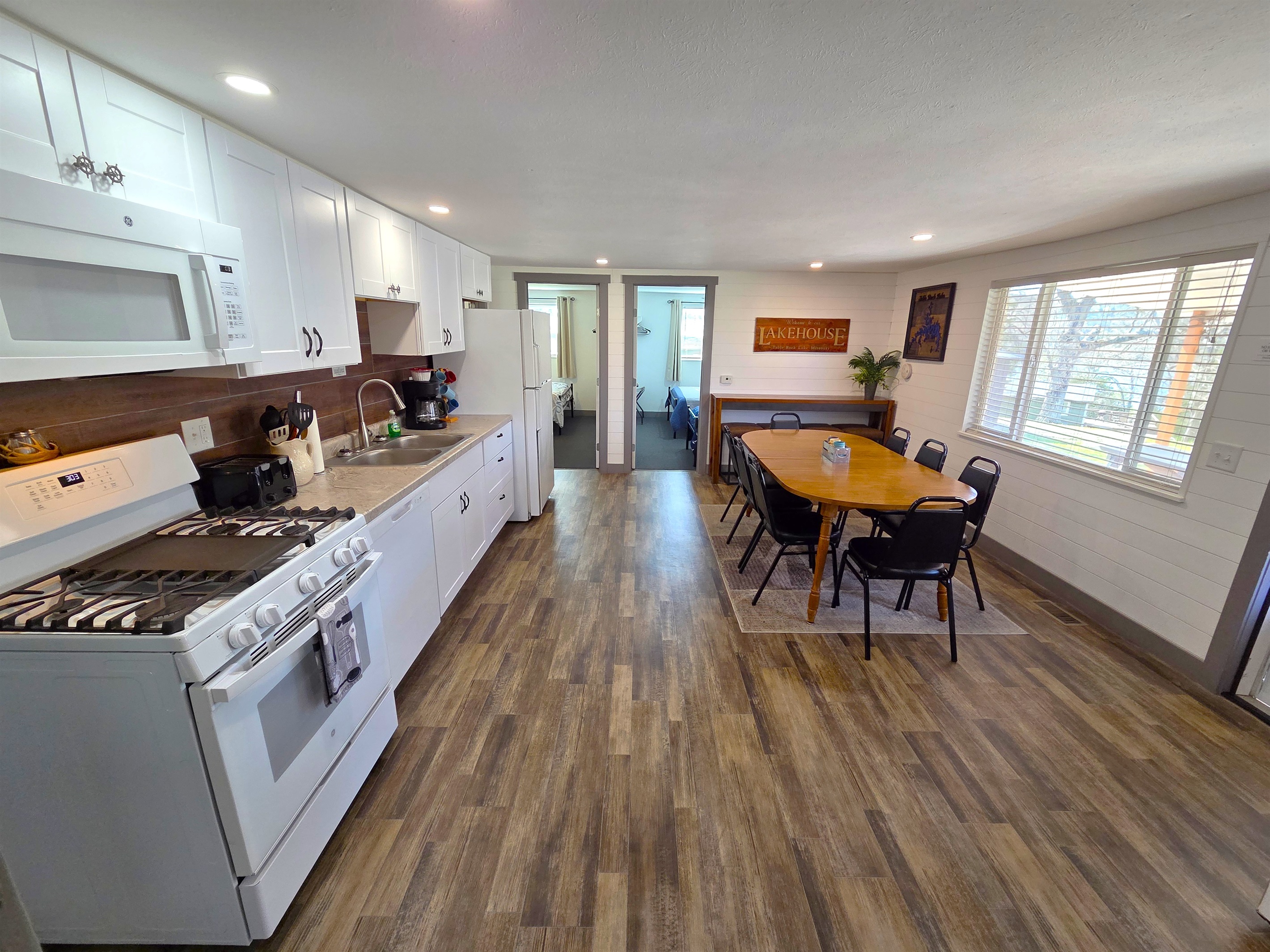 The large kitchen & dining area is perfect for dinners with the table that seats 8 & the bar at the end that can accommodate 4.