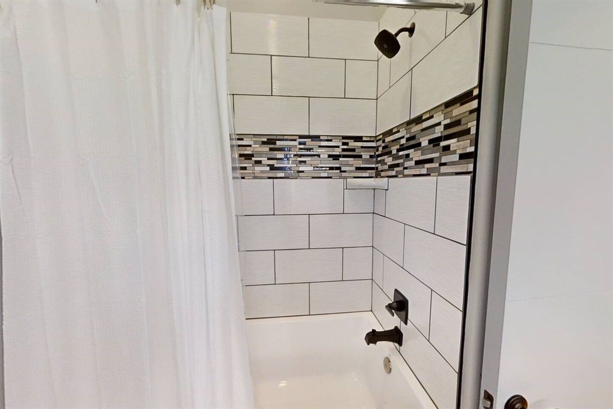 We included an extra tall shower head in the hallway restroom so you won’t have to worry about ducking to take a shower!  The tub is an extra deep soaker tub, so if hot baths are your thing we have you covered!!