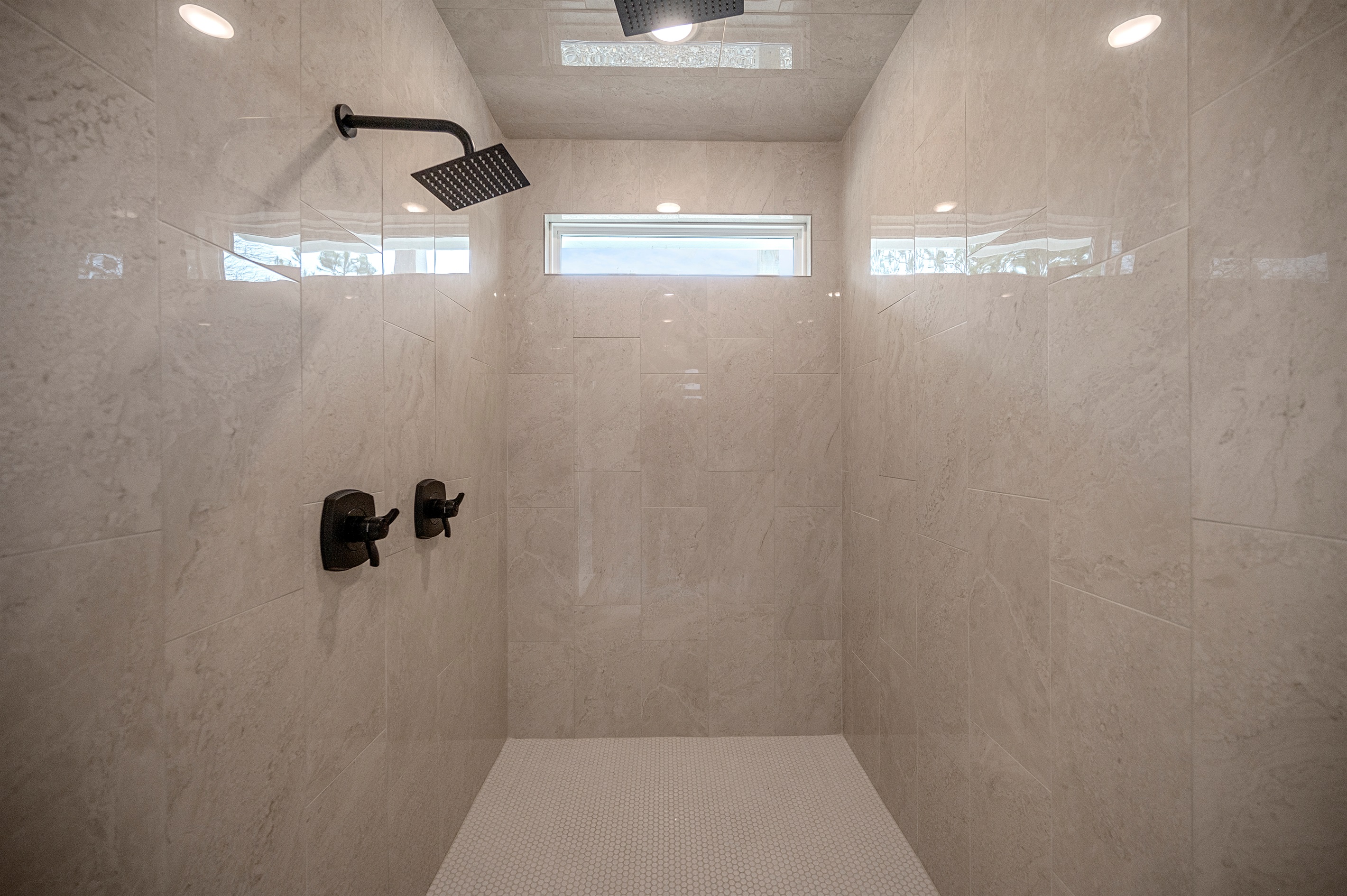 Rainfall showers & plush towels included in every suite