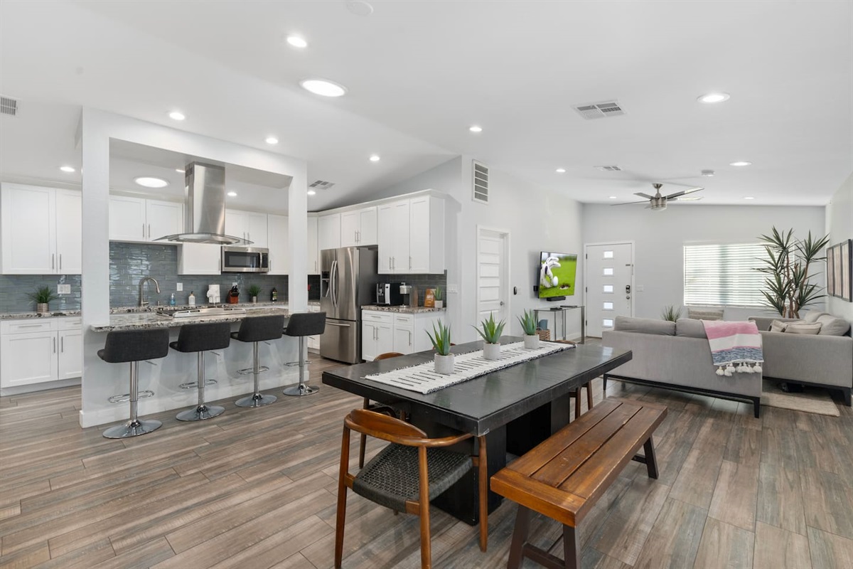 Open-concept kitchen and dining area, seamlessly fronting the spacious living area for a perfect flow of space.