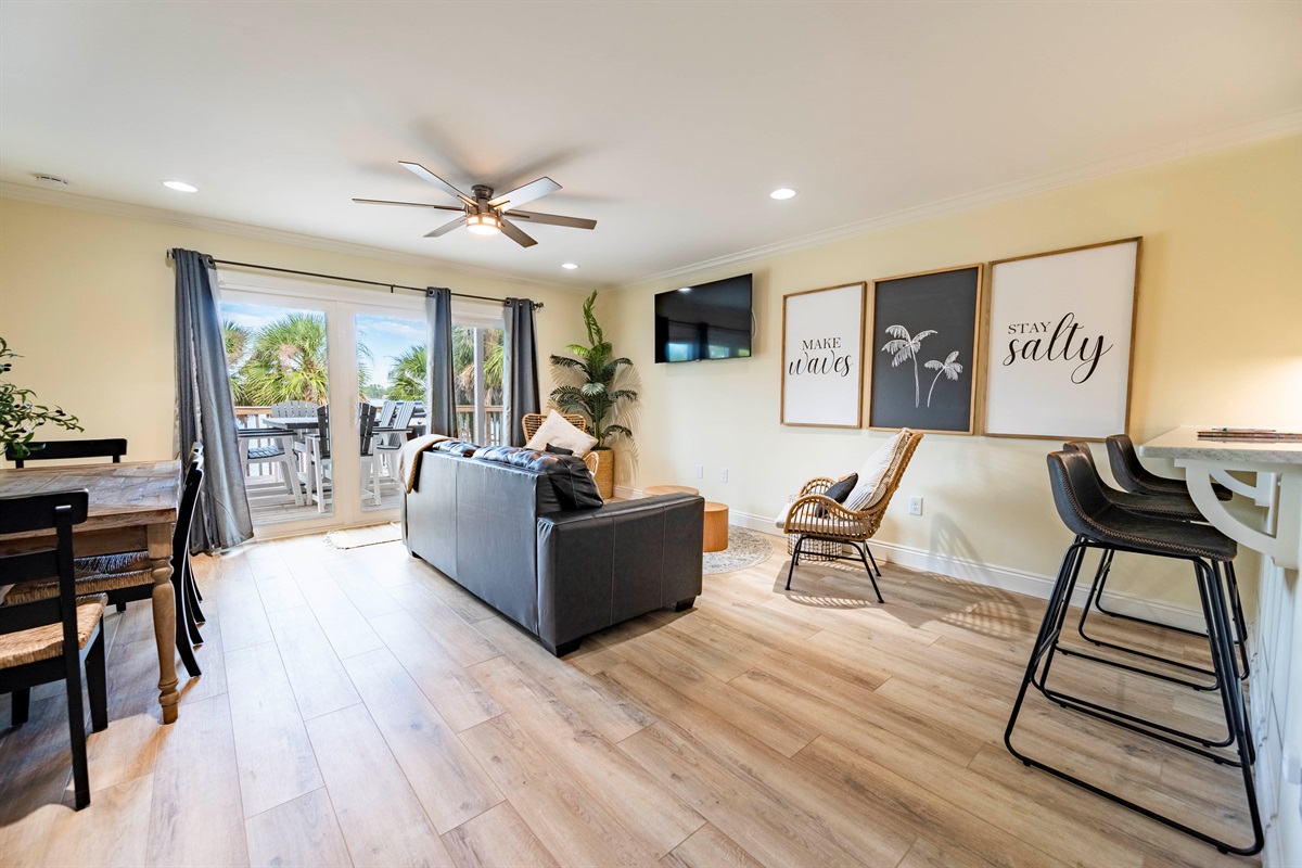 Bright living room retreat with cozy beach vibes and modern natural decor.	