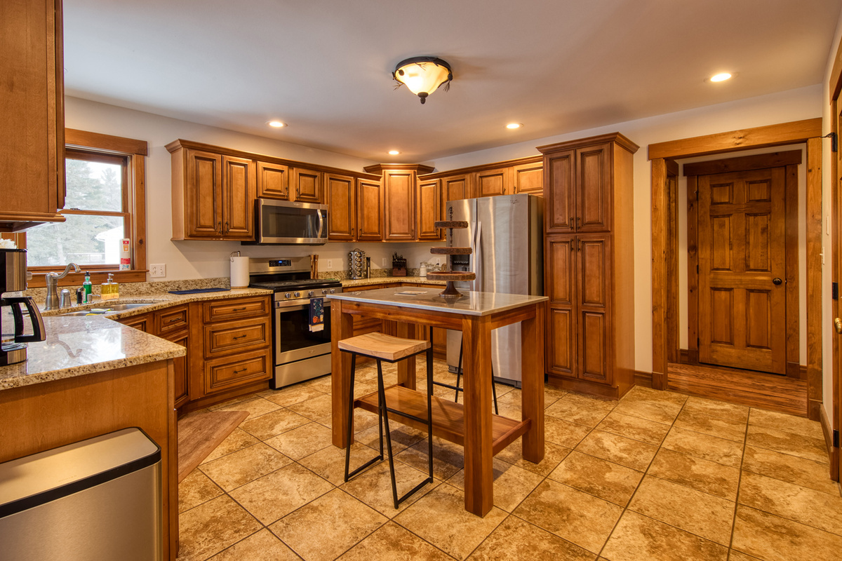 The kitchen island provides additional seating and the perfect place for morning coffee.