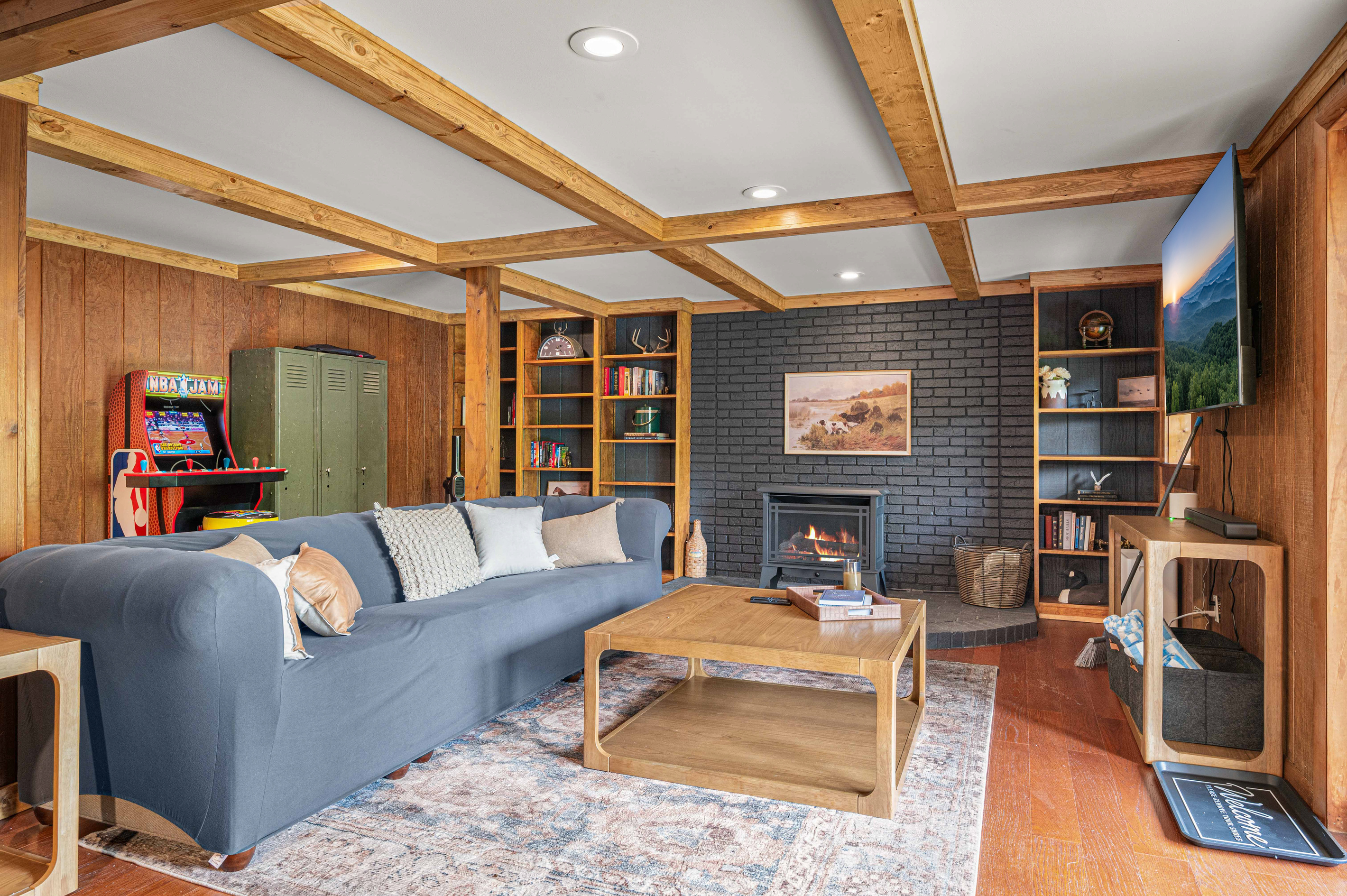 Living Room: Gather around the fireplace for fun and games in this vibrant, wood-beamed retreat!