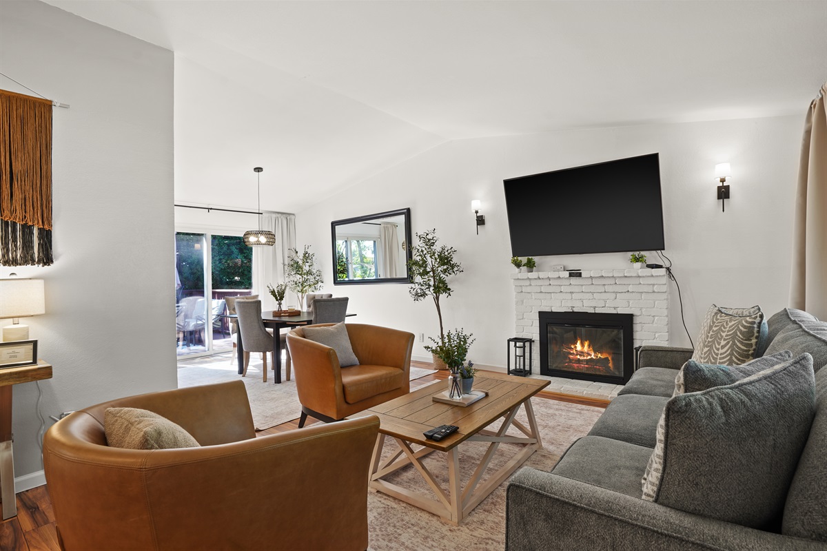 A living room that feels both elevated and effortless, with warm textures, natural light, and room to truly unwind.