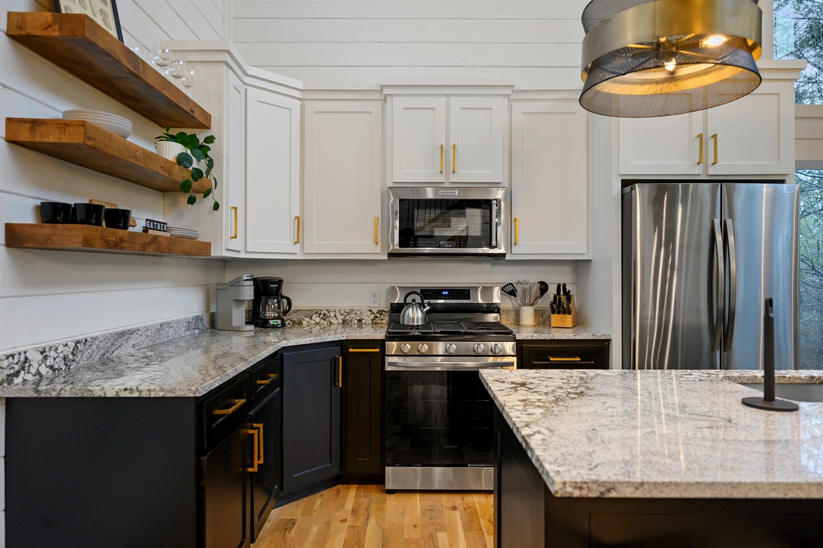 A fully equipped kitchen designed for convenience — featuring a refrigerator, microwave, and all essential appliances to make meal prep easy during your stay. ✨