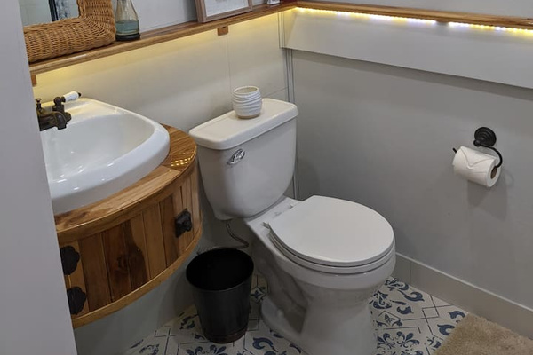 This is the 2nd bedrooms bathroom. The sink base piece was custom made because we basically look for any excuse to handcraft hardwood pieces:) 