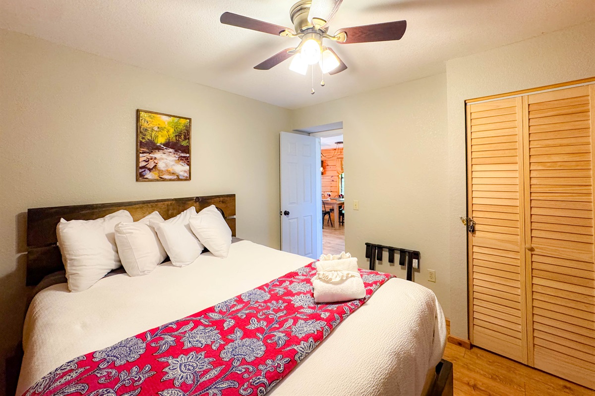 the main level bedroom features a hybrid memory foam queen bed