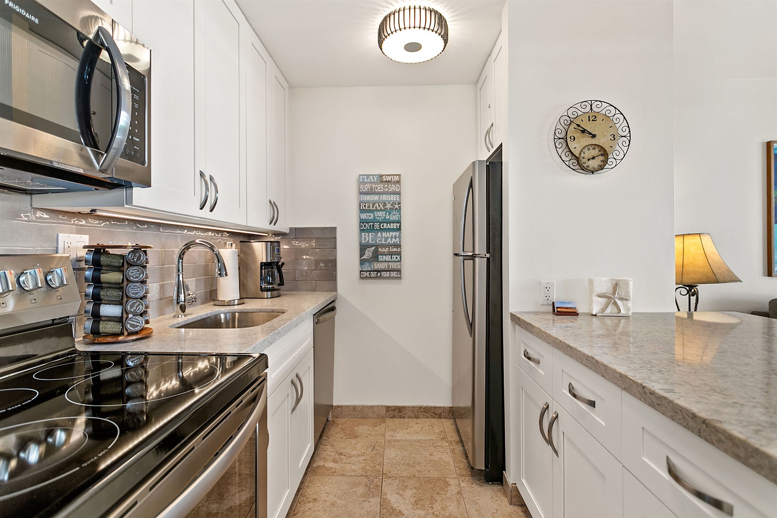 Modern kitchen with stainless steel appliances, Vitamix and spices
