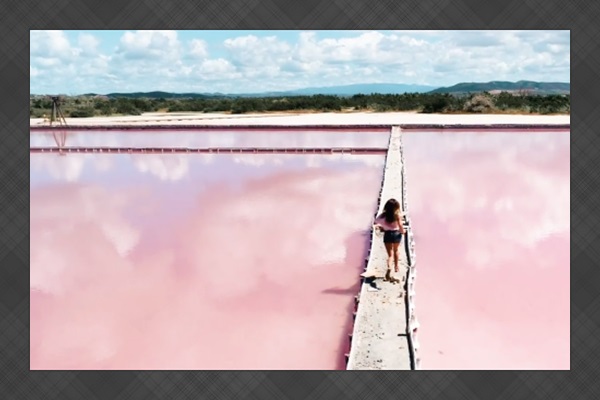 Cabo Rojo Salt Pools: Stroll along vibrant pink waters reflecting a tropical paradise!