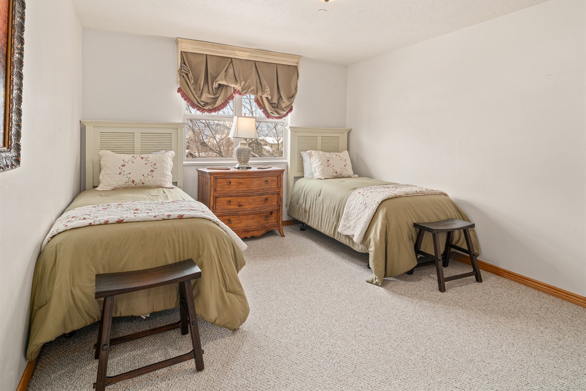 Twin bedroom with soft natural light