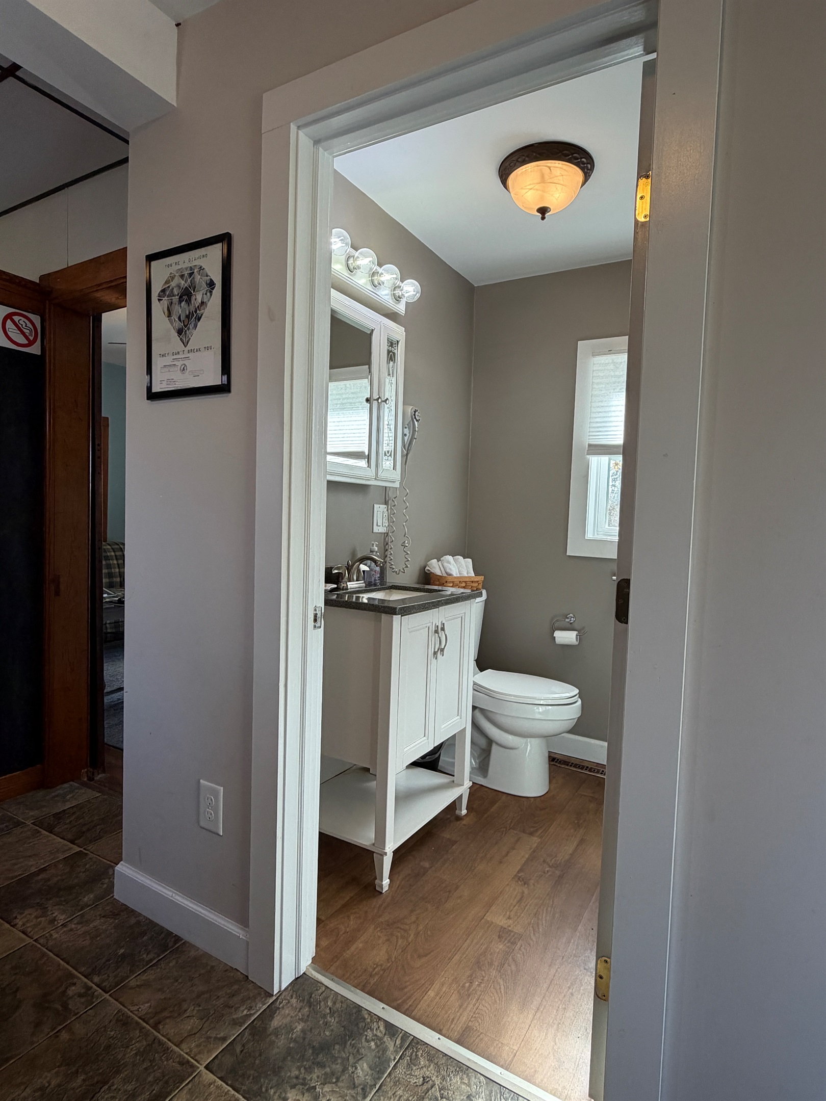 1st floor full bathroom w/ shower, note the built in hair dryers in all bathrooms.