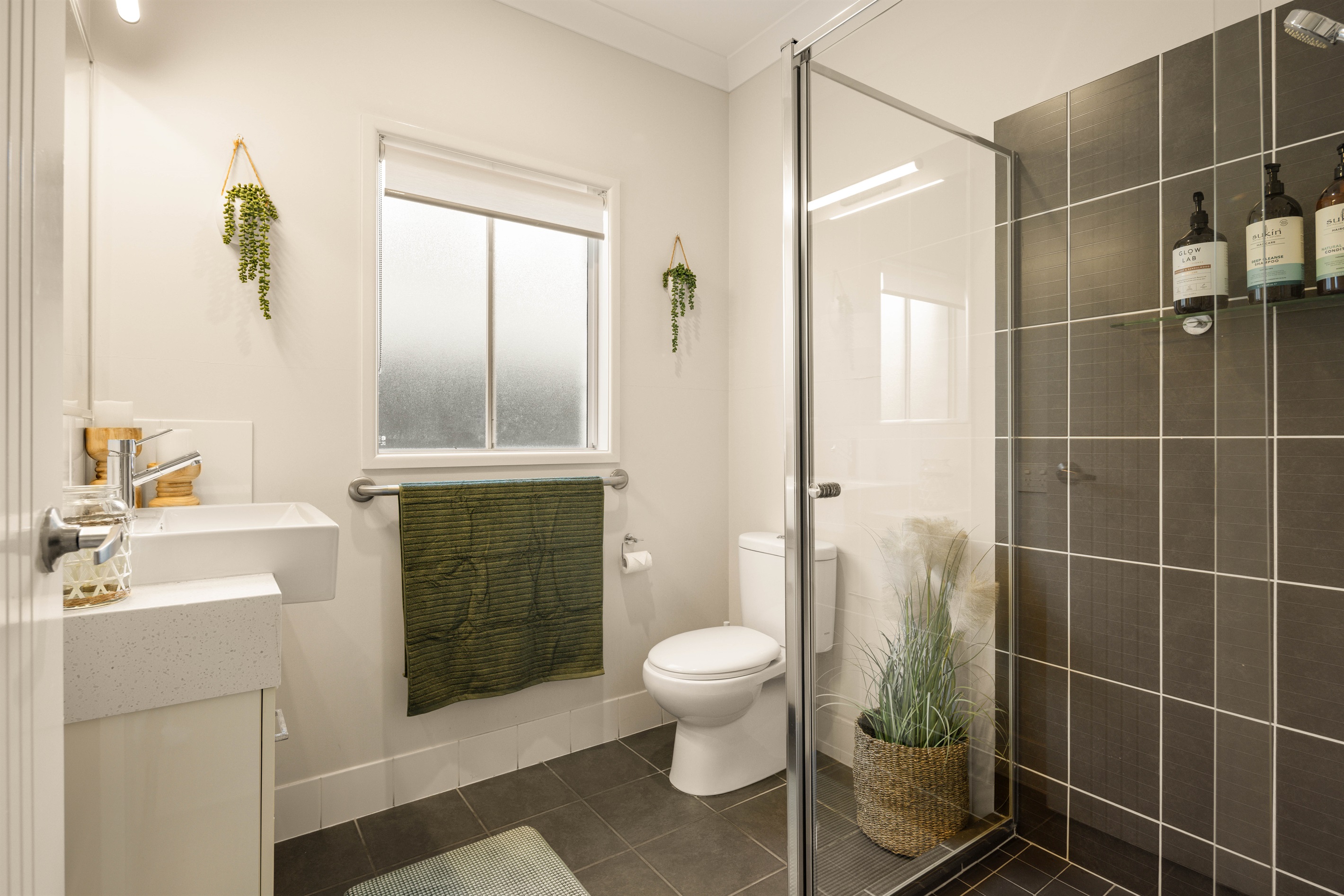 Main Shared Bathroom
Additional full bathroom near the living areas - perfect for poolside convenience and added guest comfort.