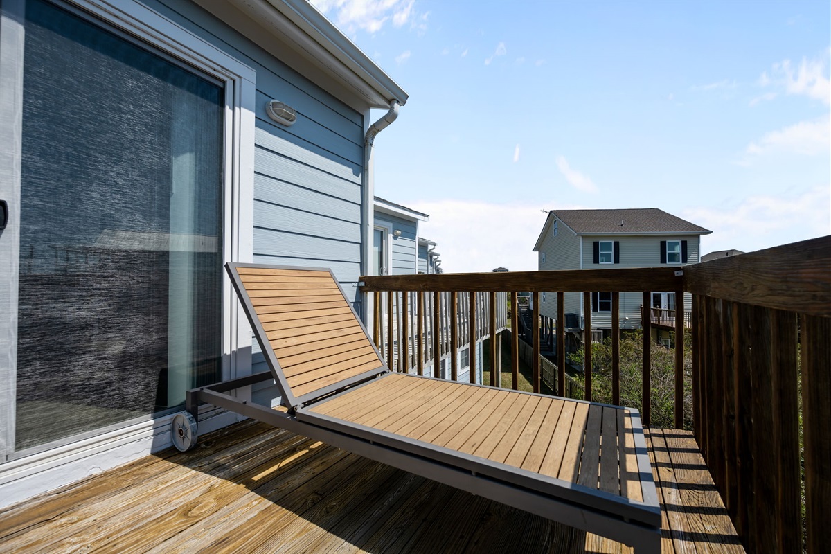 Private deck with lounge chair and neighborhood views