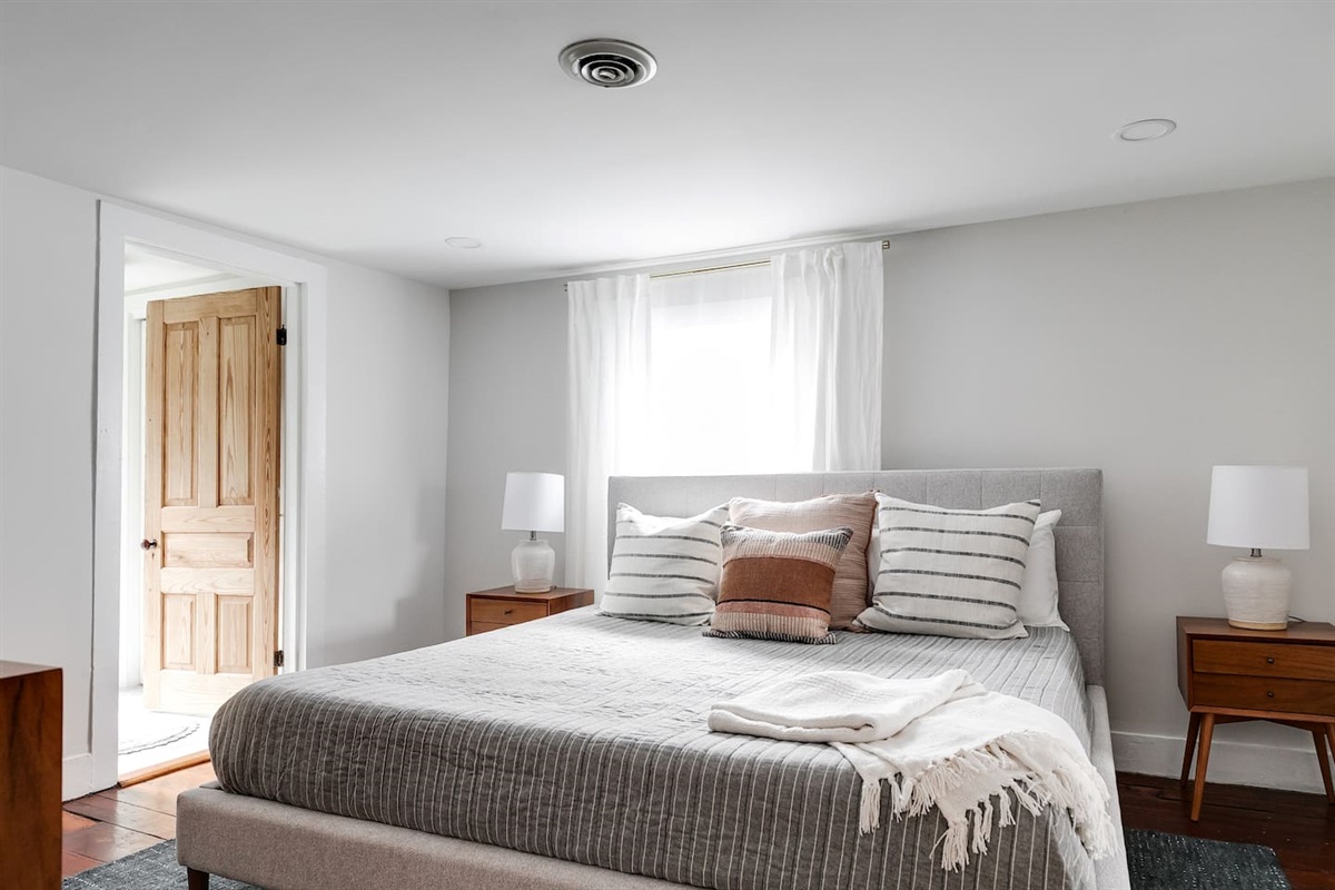 2nd Floor King Bedroom: Bright and airy with a king bed, stylish decor, and modern amenities awaits you!