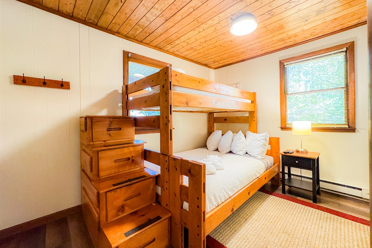 The second bedroom on the main level features a twin over full bunk bed. Roku TV's are in all bedrooms.