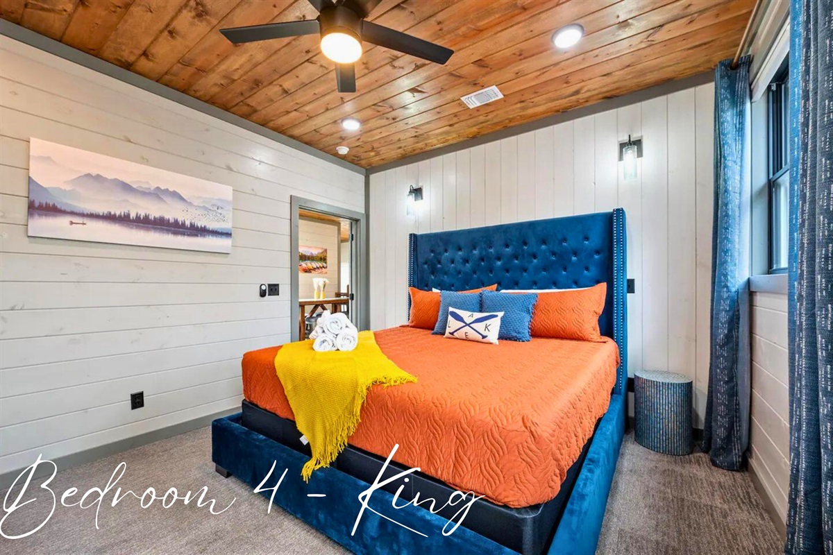 Luxurious bedding and vibrant decor await you in our charming fifth bedroom.