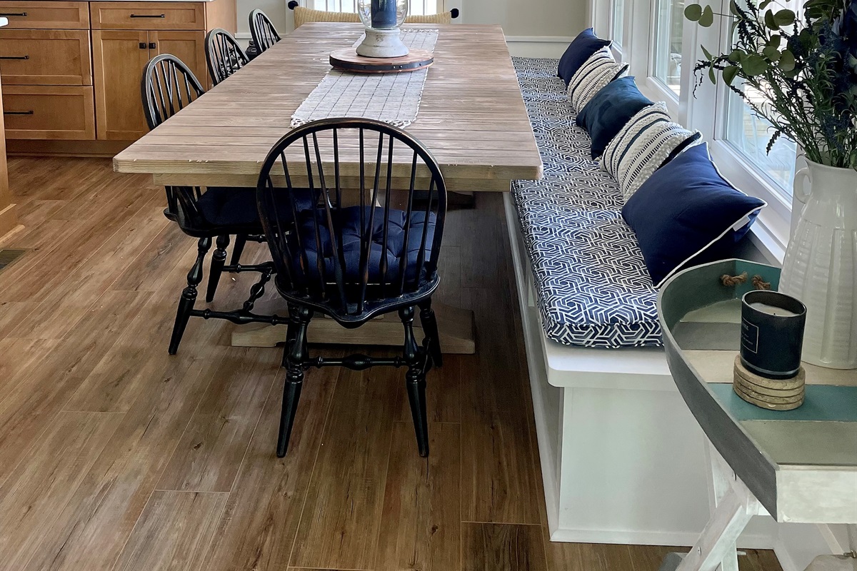 Large dining table can seat 10-12 with 3 more at the island