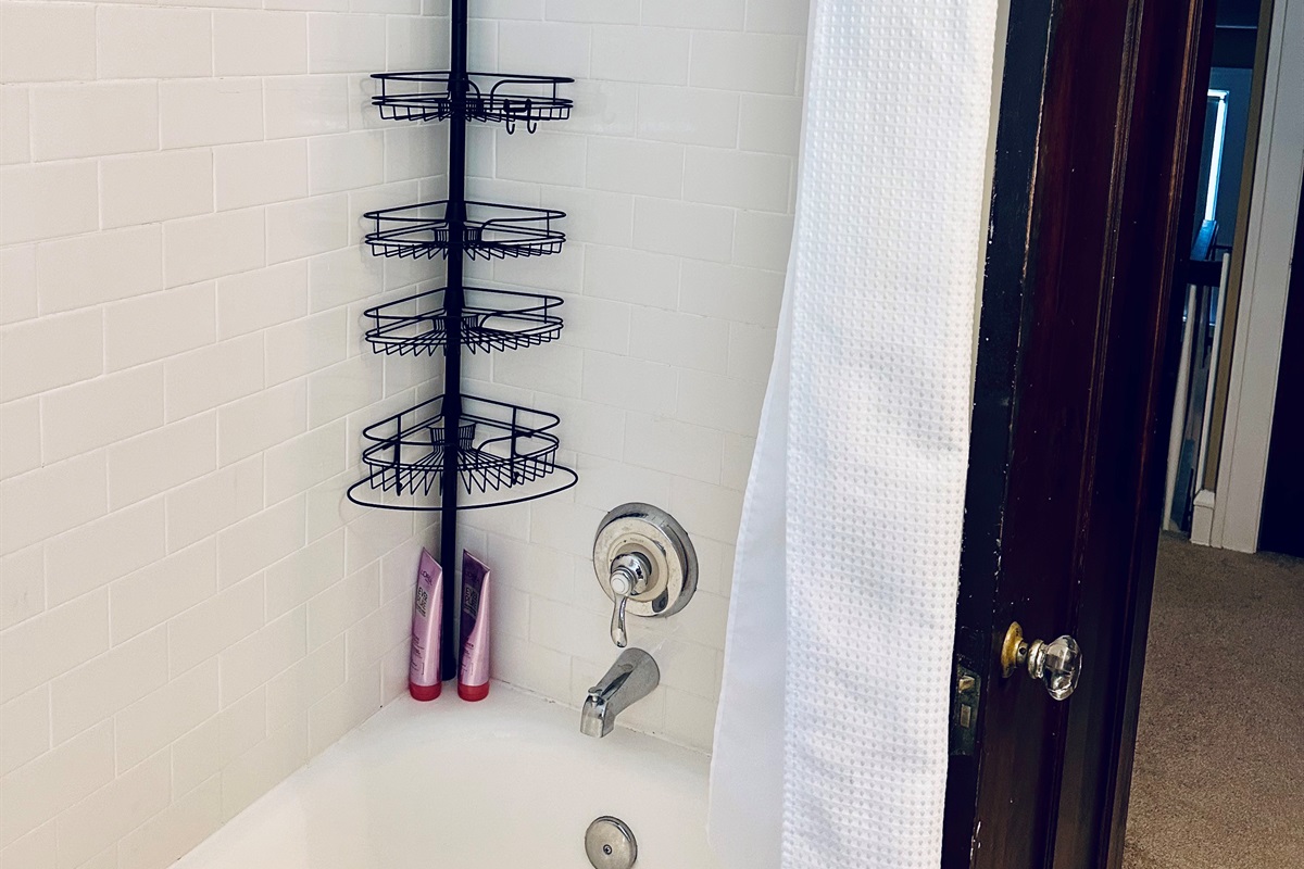 Upstairs full bath with a combination bathtub & shower.