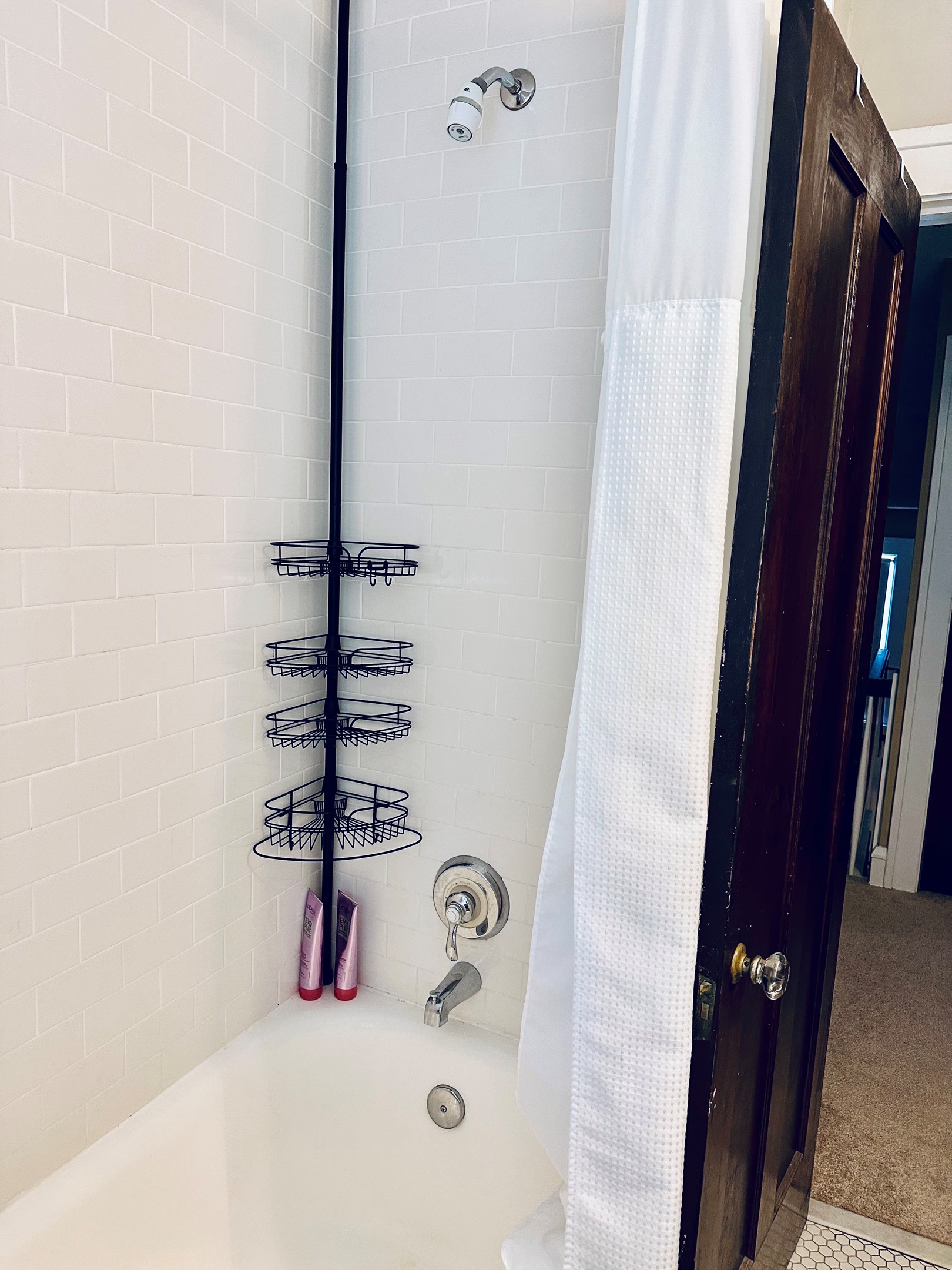 Upstairs full bath with a combination bathtub & shower.