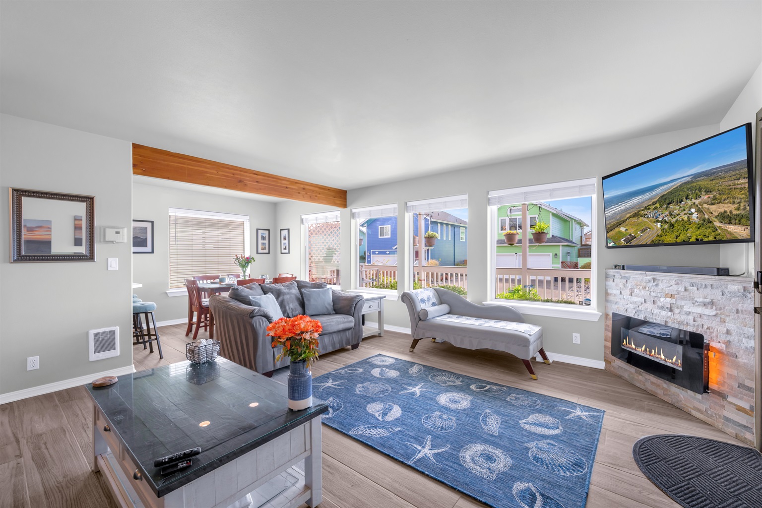 Curl up in the living room with to the ambiance of the fireplace and 60" SmartTV/cable
