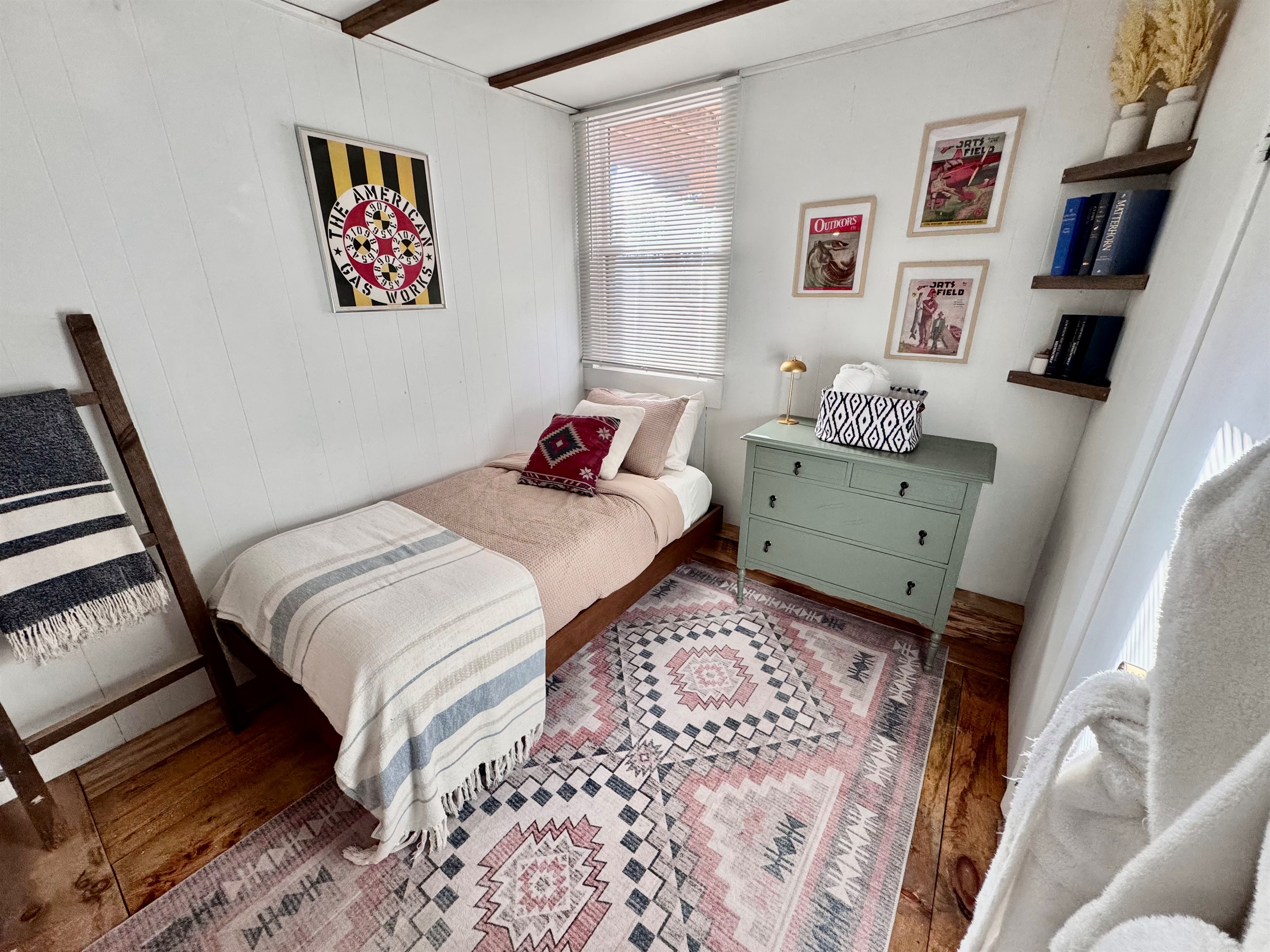 Both downstairs bedrooms have smart TVs and are bathed in natural light.  Appx 8’x9’. This room features an full en suite bathroom and a brand new bed and Casper twin size mattress (Feb 2026).