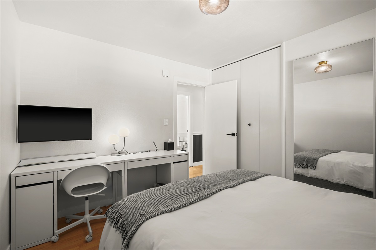 Well-appointed bedroom featuring a queen bed and relaxing ambiance, perfect for couples, friends, or family members.