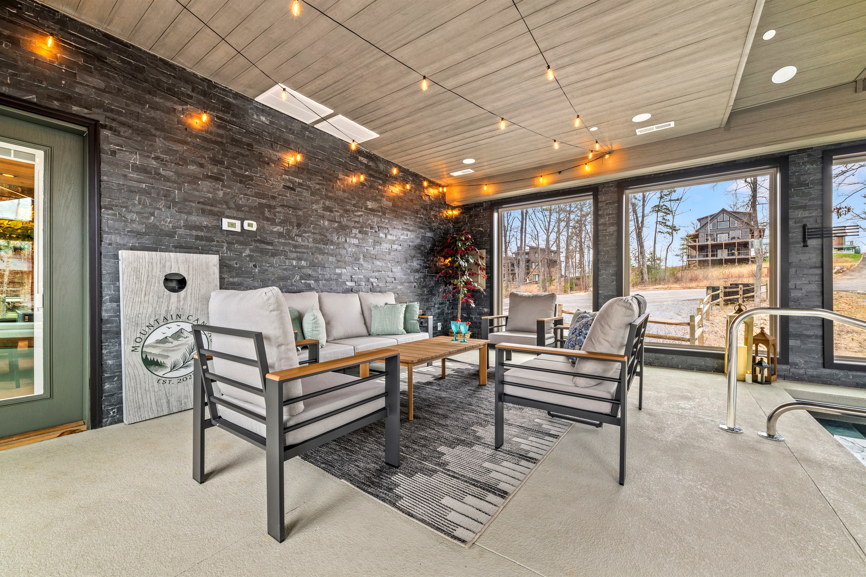 Relax in the poolside lounge area beside the indoor pool, perfect for unwinding between swims, with convenient hooks nearby for towels and swim gear.