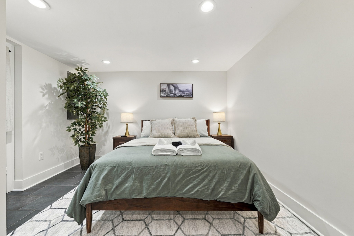 Bedroom Bliss: Relax in serene surroundings with plush bedding and soft lighting!