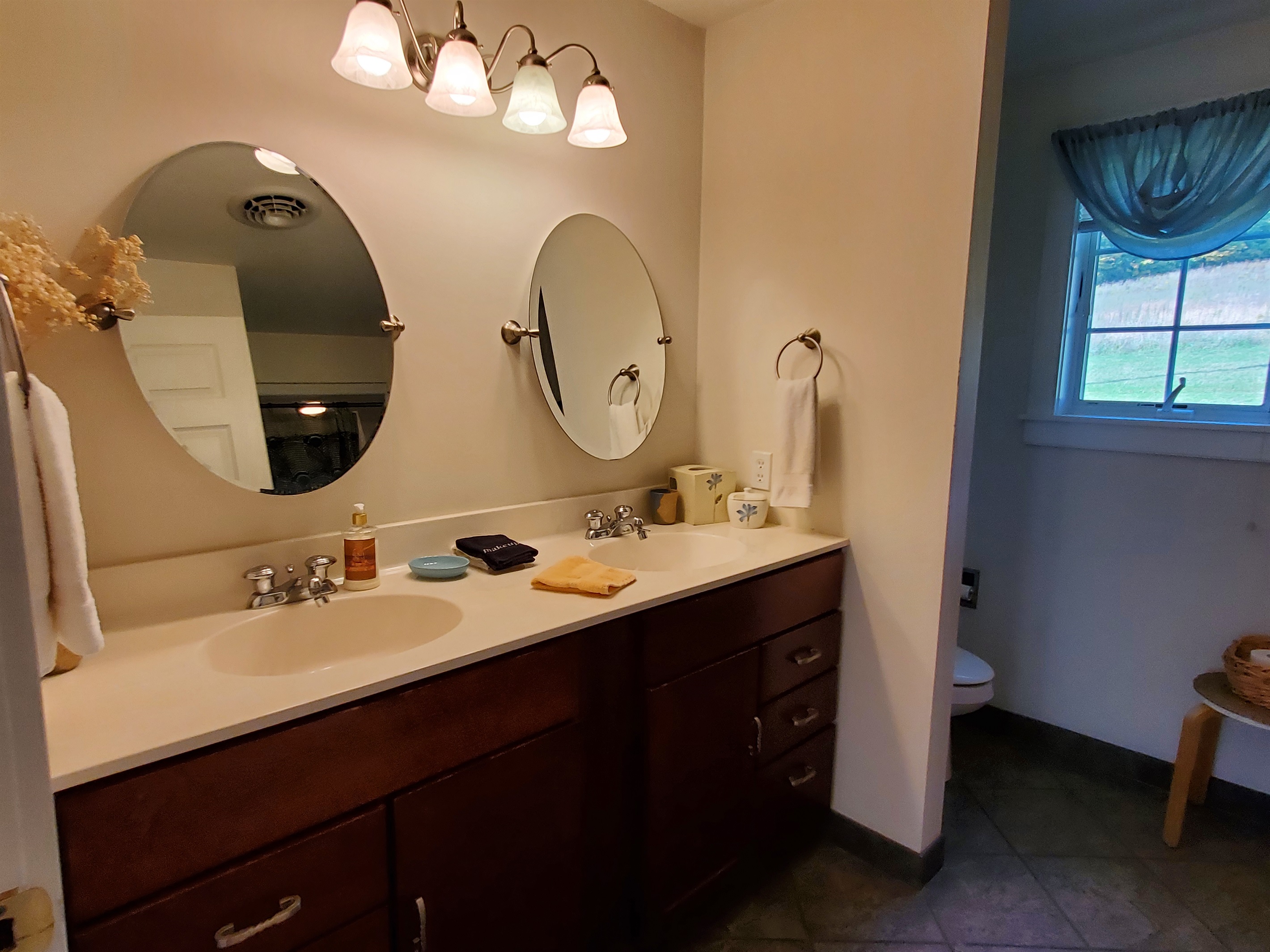 Full bathroom double vanity, across the hall from Queen #1.
